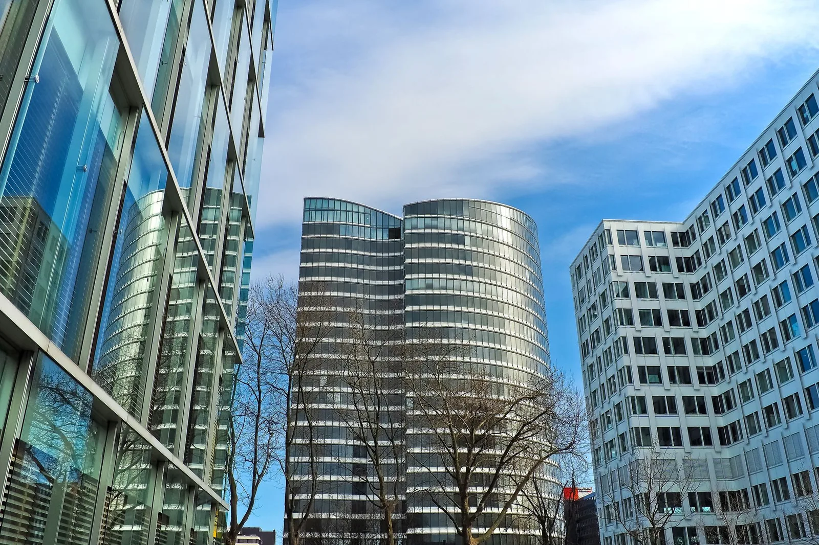 Modern office buildings around a landscaped business district