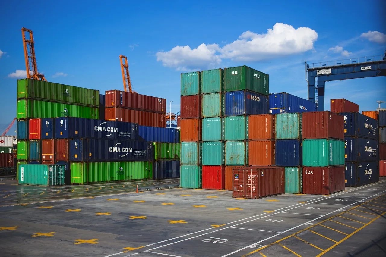 Shipping containers arranged in a logistics terminal
