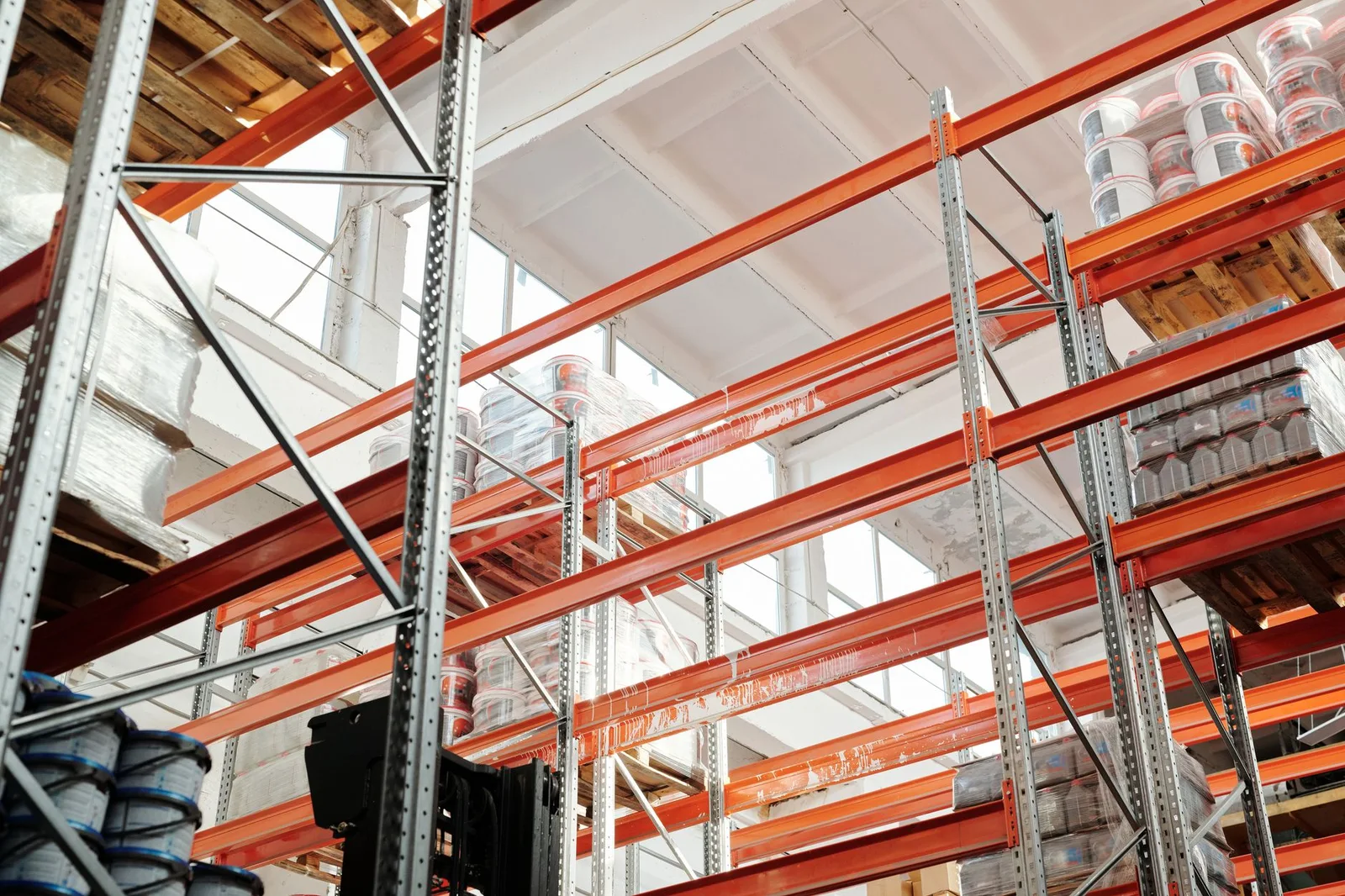 Industrial warehouse with tall storage racks and structural framing